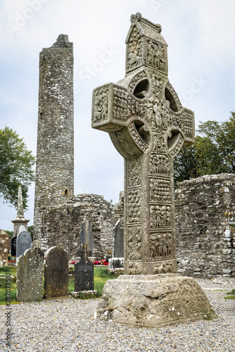 Obraz na płótnie Drogheda, Ireland - July 15, 2020: View of Muiredach's high celtic cross and round tower at early Christian monastic settlement Monasterboice founded in 5th century. w salonie