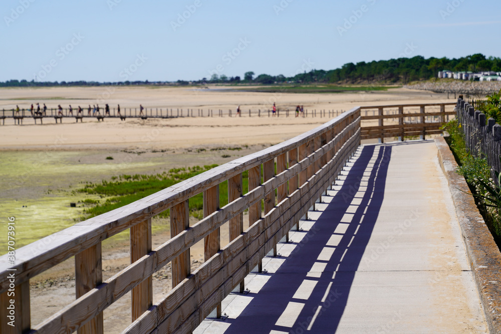 wooden path way access to public sand beach of Jard sur Mer in atlantic coast ocean France