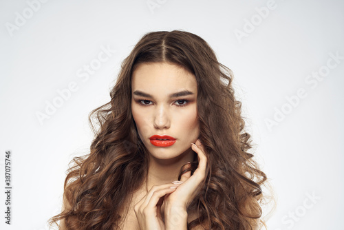 Elegant woman with bare shoulders red lips glamor attractive look cropped look