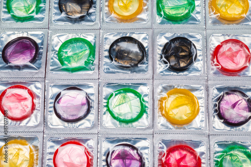 Colorful condoms background.