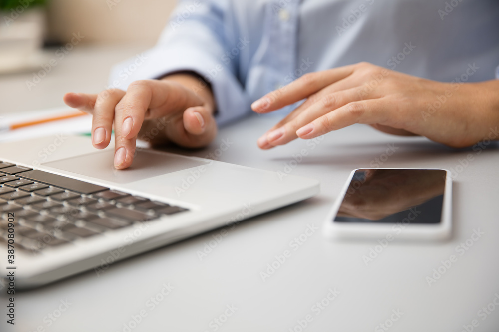 Close up of female hands typing. Remote working from home. Workplace in home office with PC, devices and gadgets. Concept of distance learning, isolation, female business, shopping online, conference. Close up of female hands typing. Remote working from home. Workplace in home office with PC, devices and gadgets. Concept of distance learning, isolation, female business, shopping online, conference.