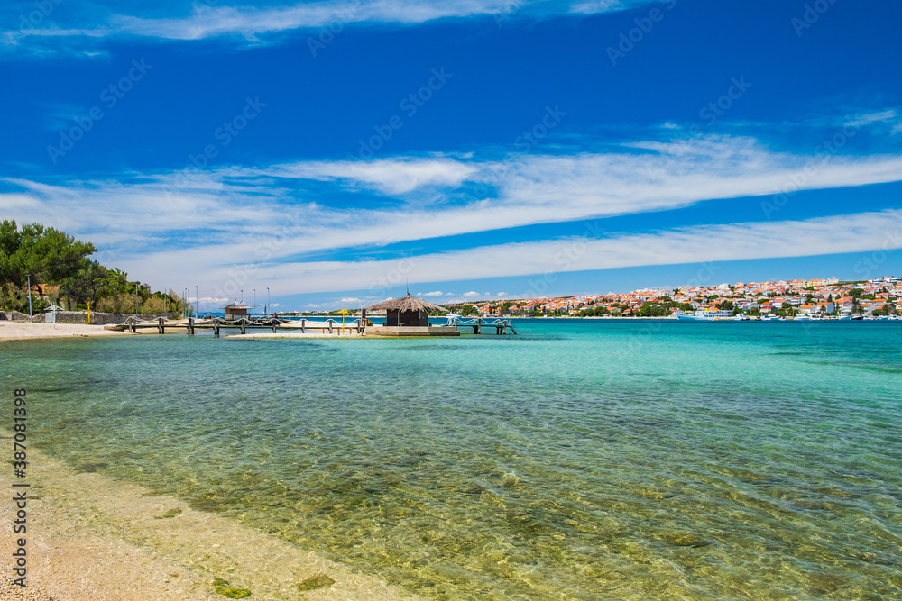 Adriatic sea in Croatia on Pag island, beautiful sand beach and bar in town of Novalja