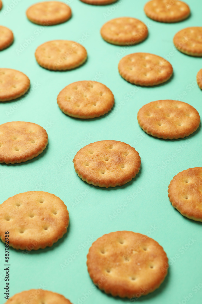 Flat lay with cracker biscuits on mint background