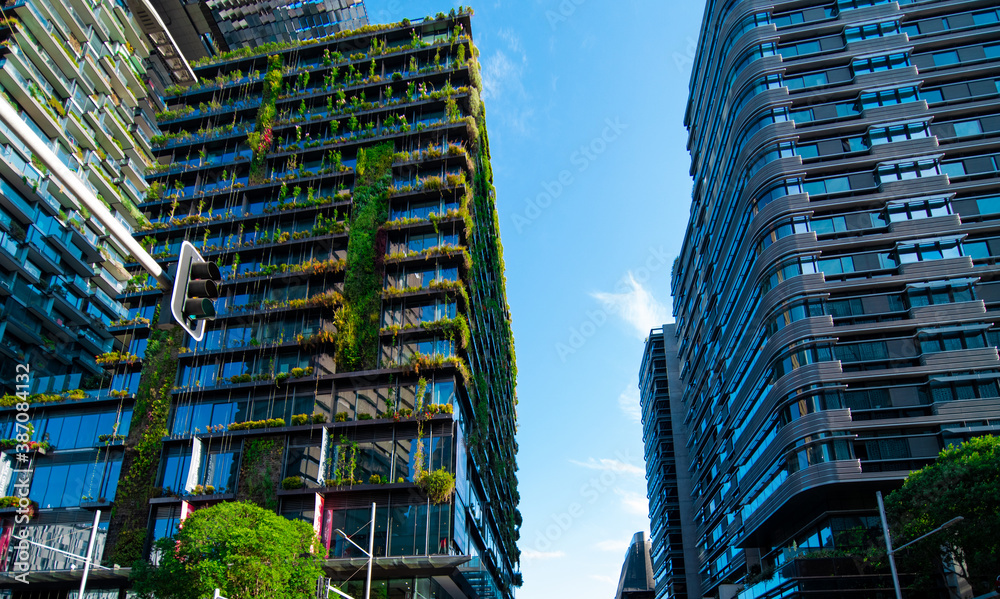 Fototapeta premium Apartment block in Sydney NSW Australia with hanging gardens and plants on exterior of the building 