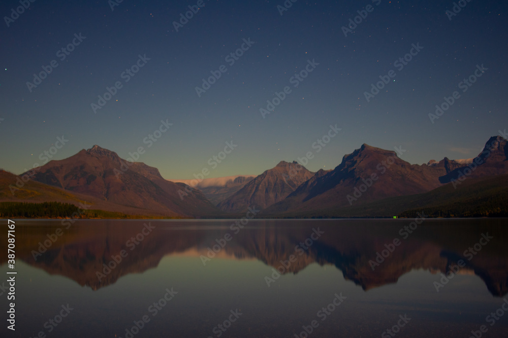Moonlit night  sky from the shore of Lake McDonald, Glacier National Park, MT, USA