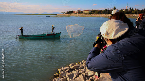 Quadro su tela Photographing the people fishing with old fishing boats and a lake, photographin