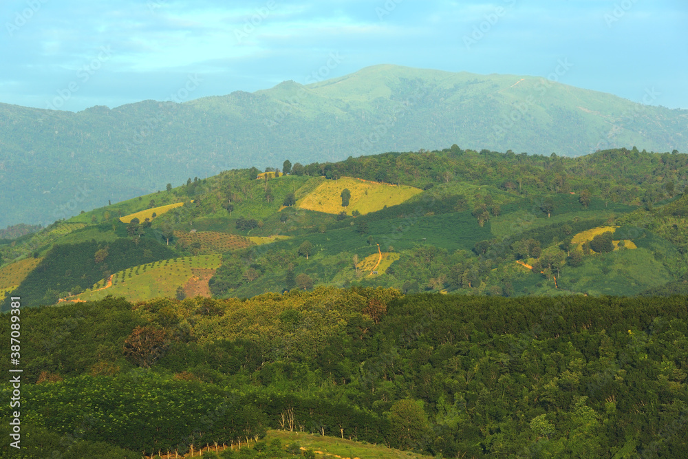 Naklejka premium Beautiful landscape of view green mountain in morning at Nan Province of Thailand