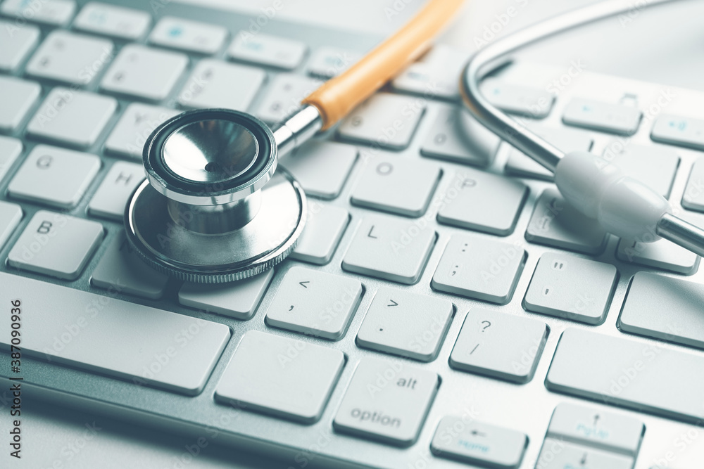 Doctor contacts concept with stethoscope on keyboard Doctor contacts concept with stethoscope on keyboard