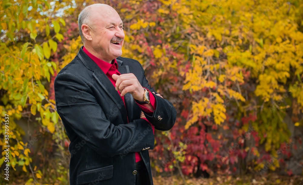 Elegant suit with marsala shirt and black jacket for seniors , lifestyle of older people Elegant suit with marsala shirt and black jacket for seniors , lifestyle of older people