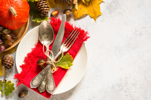 Autumn table setting top view at white table. photo