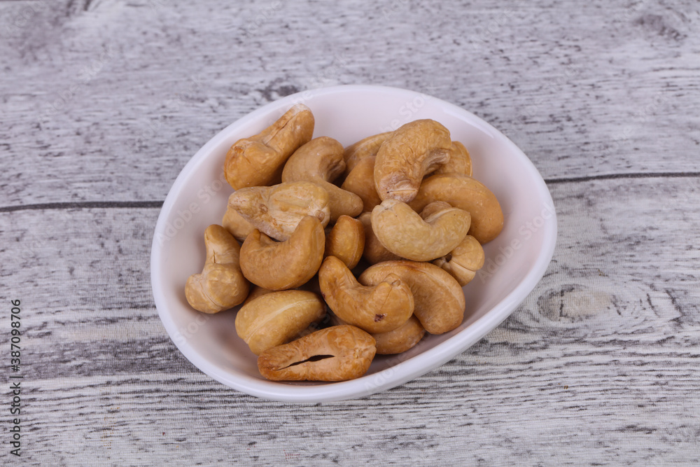 Cashew nuts heap in the bowl Cashew nuts heap in the bowl
