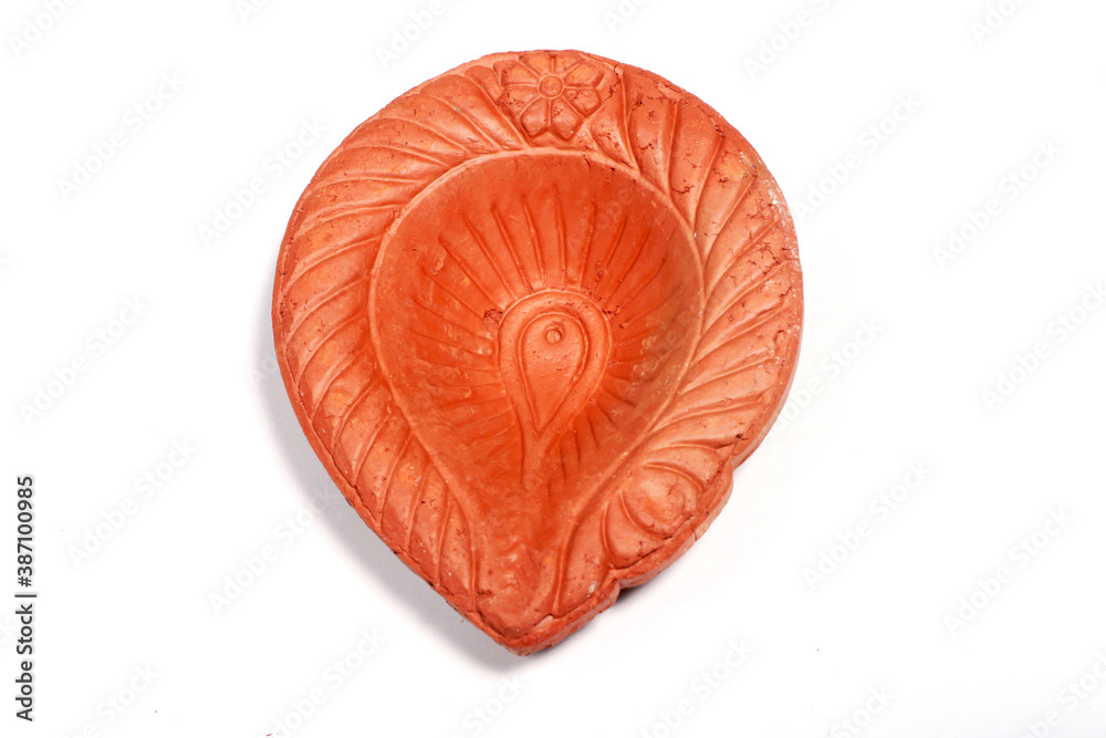 Close up of a beautifully designer handmade clay lamp isolated on white background Close up of a beautifully designer handmade clay lamp isolated on white background