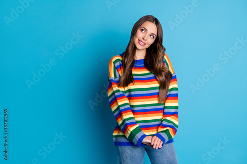Portrait of her she nice attractive lovely pretty cute creative shy cheery brown-haired girl creating solution copy space isolated bright vivid shine vibrant blue color background