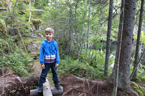 Kid in summer forest