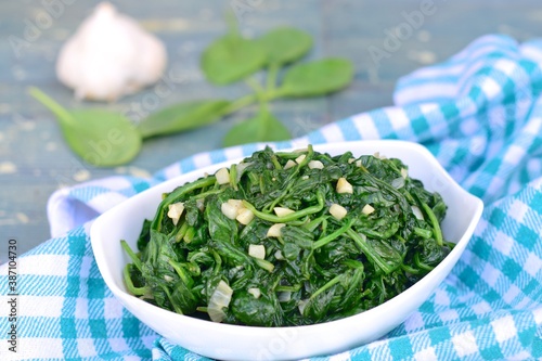 Stir fried garlic spinach. Healthy diet vegetarian