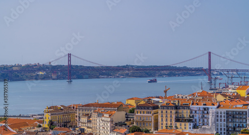 Panoramic aerial view of Lisbon, Portugal with 25 April Bridge and Tagus River