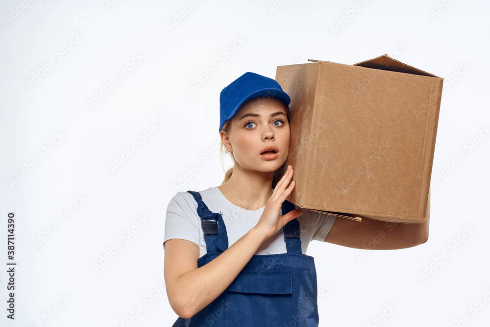 Woman working uniform box in hands packing service light background Woman working uniform box in hands packing service light background