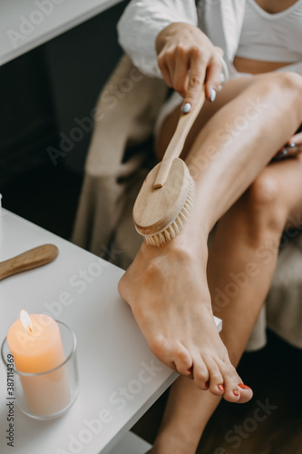 Obraz na plátne Dry brushing body brush for exfoliating dry skin, lymphatic drainage and cellulite treatment