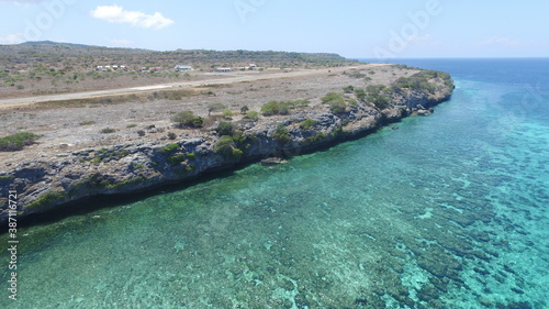 This is an airstrip on the island of Kisar which is close to the ocean and looks so beautiful photo