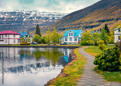 Gloomy morning cityscape of small fishing town - Seydisfjordur. Colorful summer scene of east west Iceland, Europe. Traveling concept background.