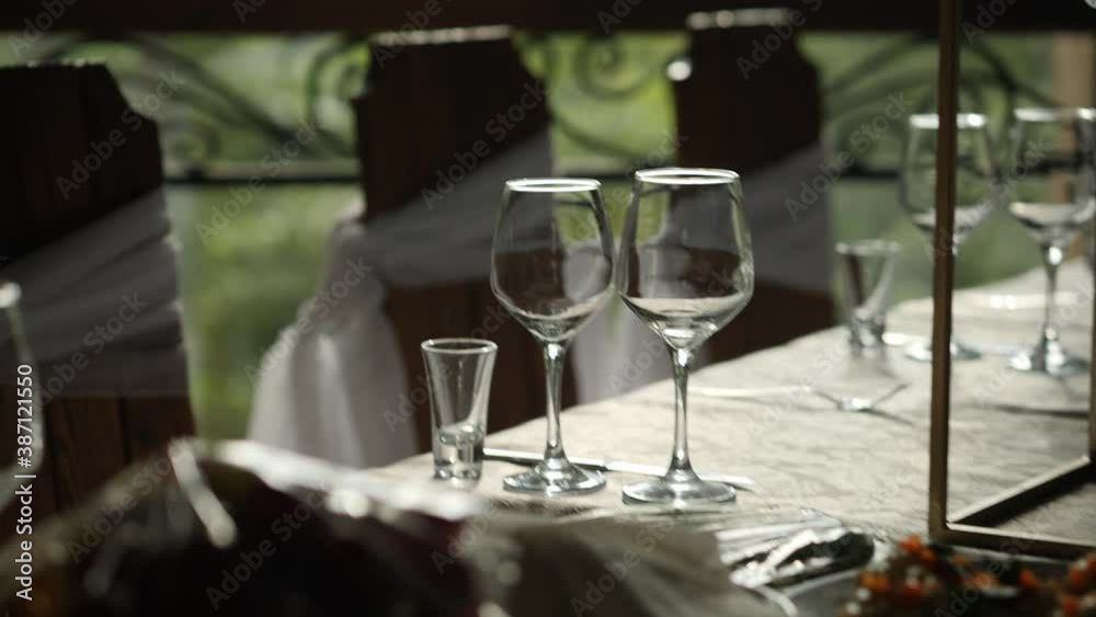 beautiful glasses shimmer in the sun. Glasses on the holiday table beautiful glasses shimmer in the sun. Glasses on the holiday table