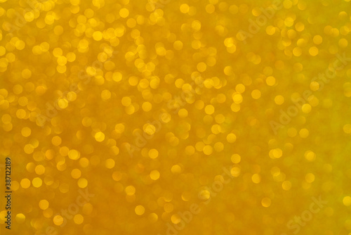 Abstract golden background. Beautiful bokeh effect. Light circles background.