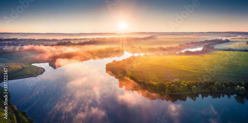 View from flying drone of Romanivka lake. Breathtaking summer scene of Ukrainian countryside, Ternopil region. Majestic sunrise on Ukraine, Europe. Traveling concept background. photo