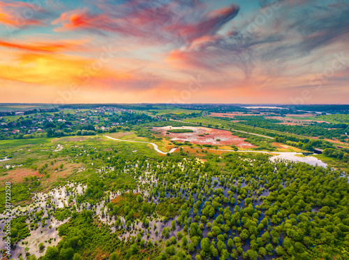 Summer view from flying drone of flooded valley of Seret river. Splendid sunrise on Ternopil countryside, Ukraine, Europe. Traveling concept background.. photo