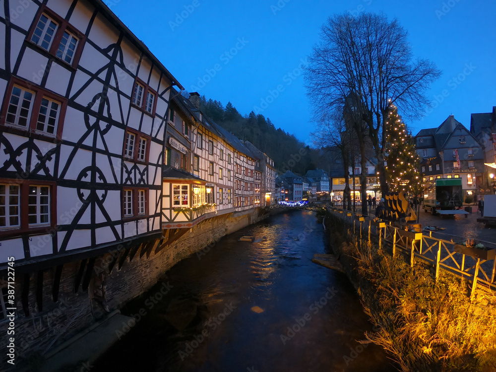 Monschau / Germany - December 28, 2019: Half-timbered houses along the Rur river in Monschau. The town is a small resort town in the Eifel region of western Germany, located in the Aachen district.