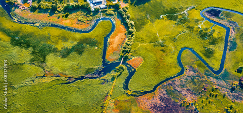 Straight dawn panoramic view from flying drone of bridge over Seret river  Ternopil region  Ukraine  Europe. Exciting summer scene of green flooded valley. Beauty of nature concept background.