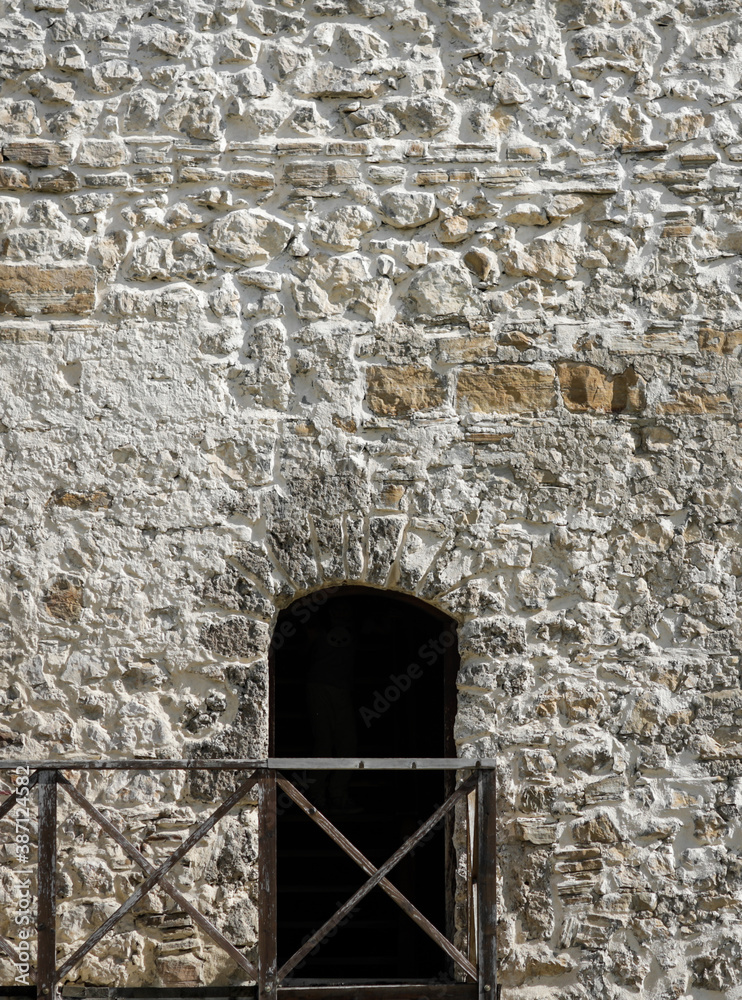 Dark entrance inside a medieval stone tower