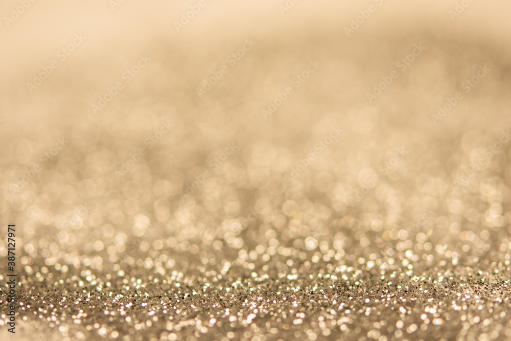 abstract blurred gold bokeh background. festive decoration for website and banner or card design concept