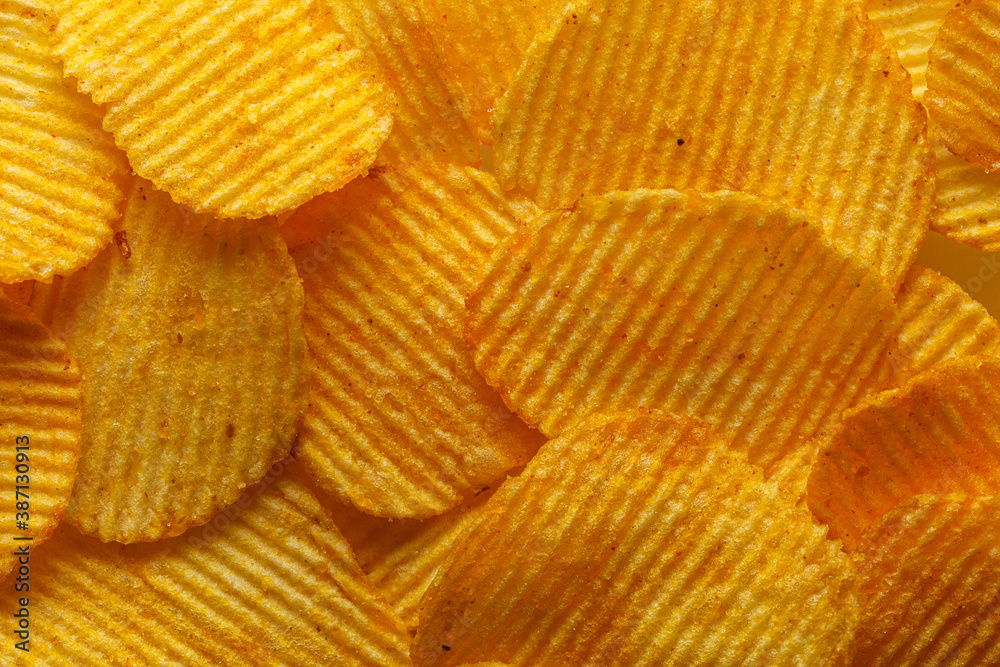 macro of beautiful corrugated yellow chips under the sun's rays macro of beautiful corrugated yellow chips under the sun's rays