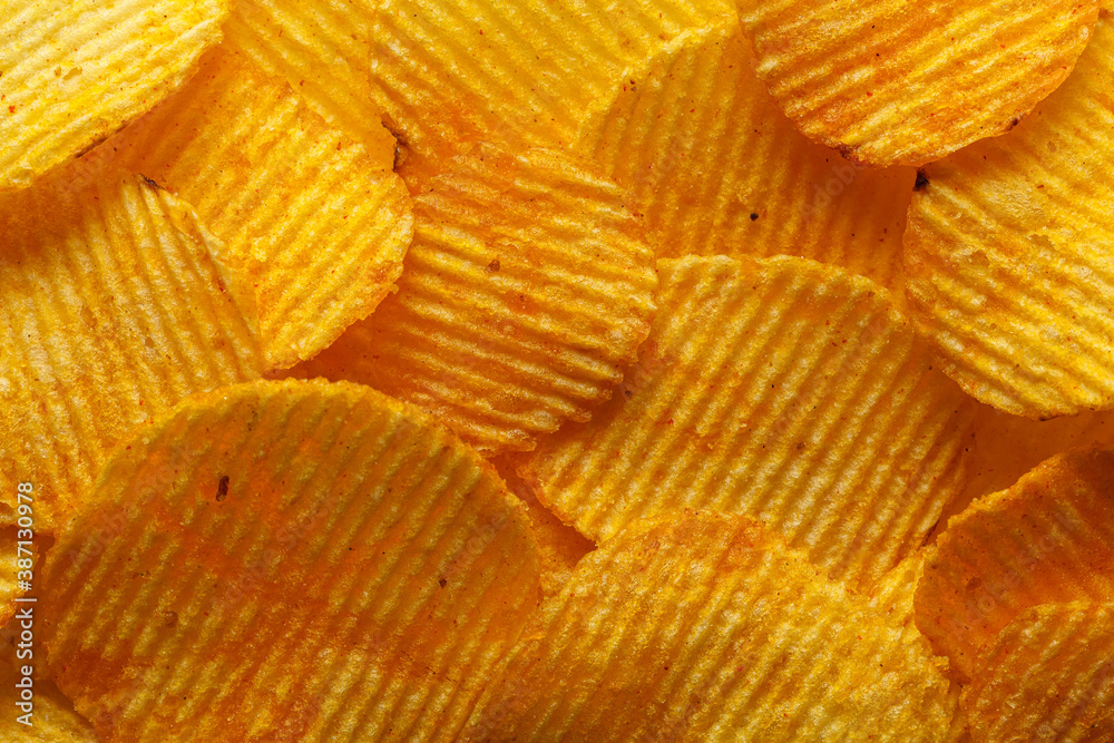 macro of beautiful corrugated yellow chips under the sun's rays macro of beautiful corrugated yellow chips under the sun's rays