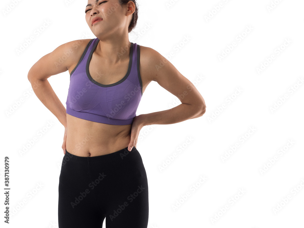 Asian woman in sportswear feeling pain at the back after exercise. Sports injury. Asian woman in sportswear feeling pain at the back after exercise. Sports injury.