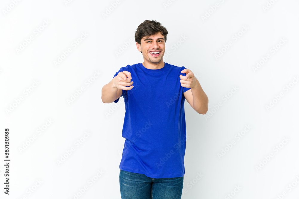 Young cool man cheerful smiles pointing to front. Young cool man cheerful smiles pointing to front.