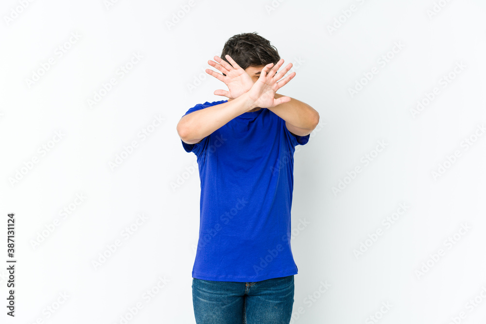 Young cool man keeping two arms crossed, denial concept. Young cool man keeping two arms crossed, denial concept.