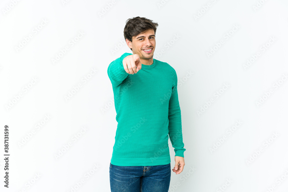 Fototapeta premium Young cool man pointing to front with fingers.