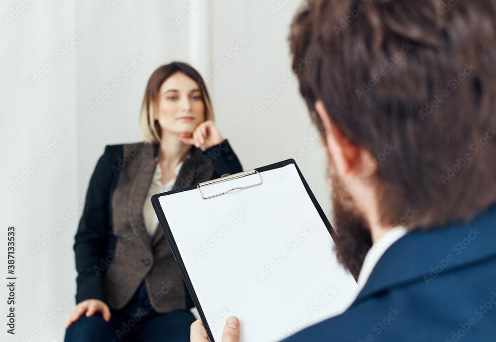 Woman for job interview and business man with documents of employee communication Woman for job interview and business man with documents of employee communication