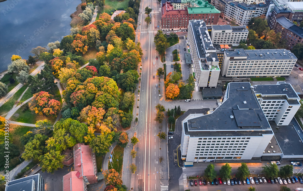 Aerial view of the Mannerheimintie street with many yellow trees. The autumn cityscape, Helsinki, Finland.