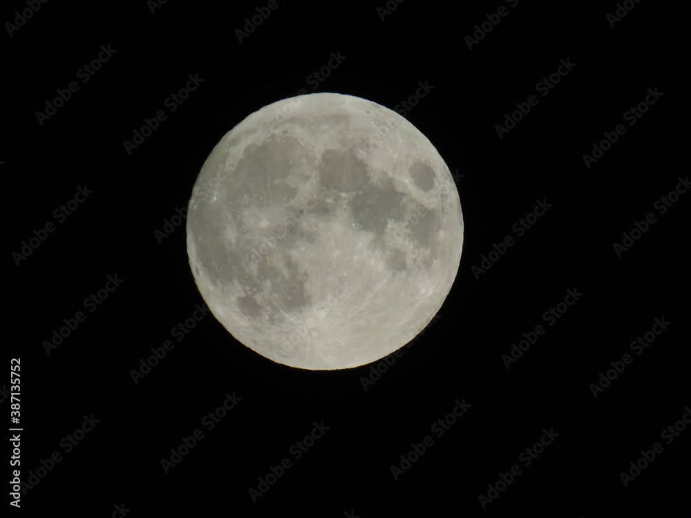 Genova, Italy - 09/25/2020: An amazing photography of the full moon over the city of Genova by night with a great clear sky in background and some stars Genova, Italy - 09/25/2020: An amazing photography of the full moon over the city of Genova by night with a great clear sky in background and some stars