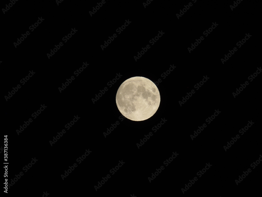 Genova, Italy - 09/25/2020: An amazing photography of the full moon over the city of Genova by night with a great clear sky in background and some stars Genova, Italy - 09/25/2020: An amazing photography of the full moon over the city of Genova by night with a great clear sky in background and some stars