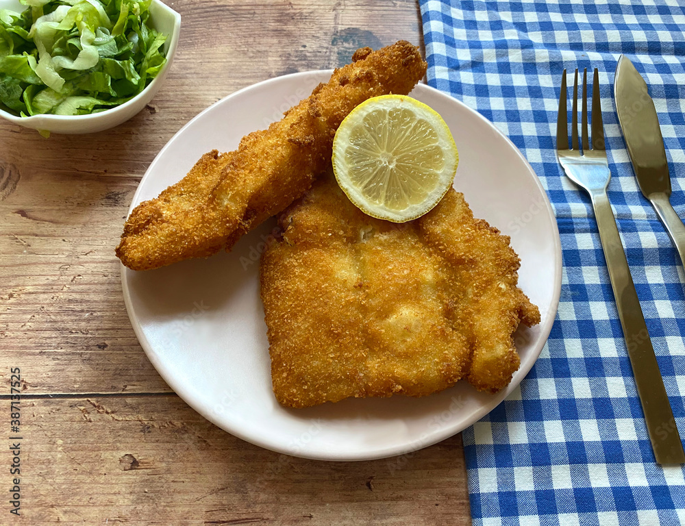 Zdjęcie Stock Breaded cod fish fillet, also known as Kabeljau. The