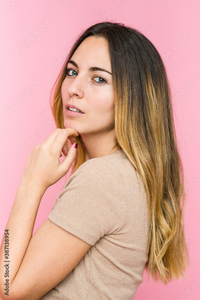Young beautiful woman isolated on pink background Young beautiful woman isolated on pink background