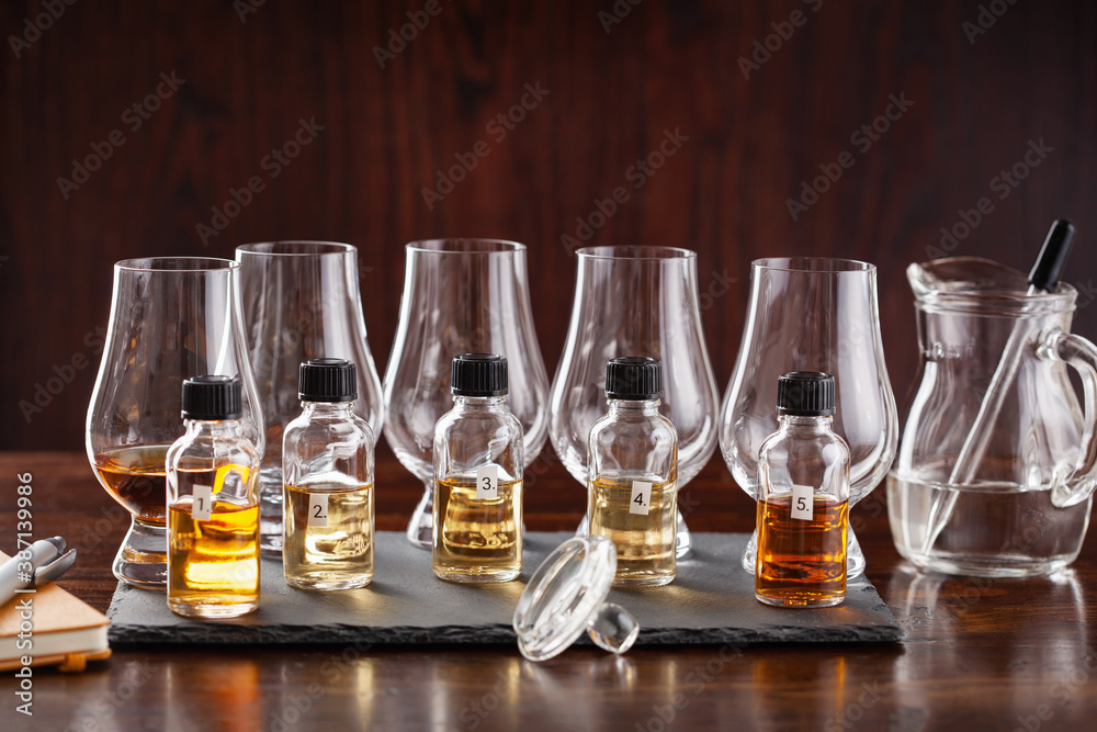 tasting bottles and glasses of whisky spirit brandy cognac. tasting at home