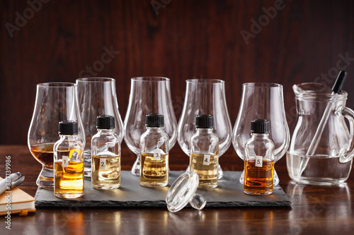 tasting bottles and glasses of whisky spirit brandy cognac. tasting at home