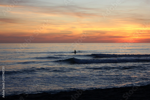 Surfing in corona times at Forte dei Marmi, Tuscany, Italy © glashaut
