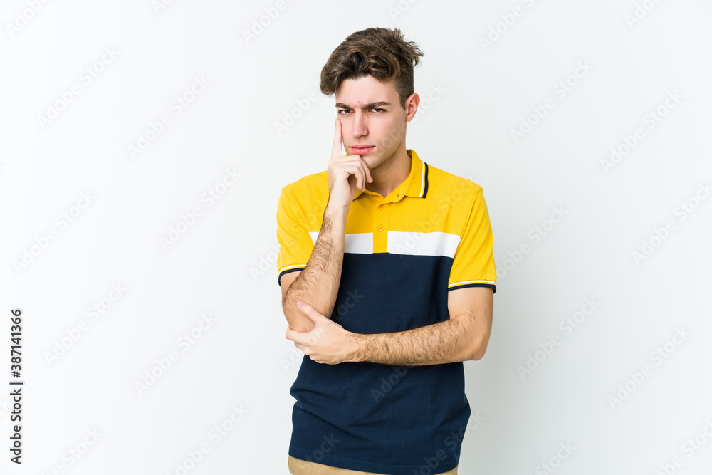 Young caucasian man isolated on white background contemplating, planning a strategy, thinking about the way of a business. Young caucasian man isolated on white background contemplating, planning a strategy, thinking about the way of a business.