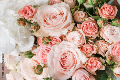 A beautiful bouquet with pale pink roses close-up. Background from flowers. Background for congratulations. Flowers for birthday. Romantic background.