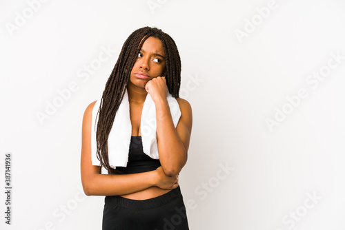 Young african american sport woman isolated who feels sad and pensive, looking at copy space. © Asier